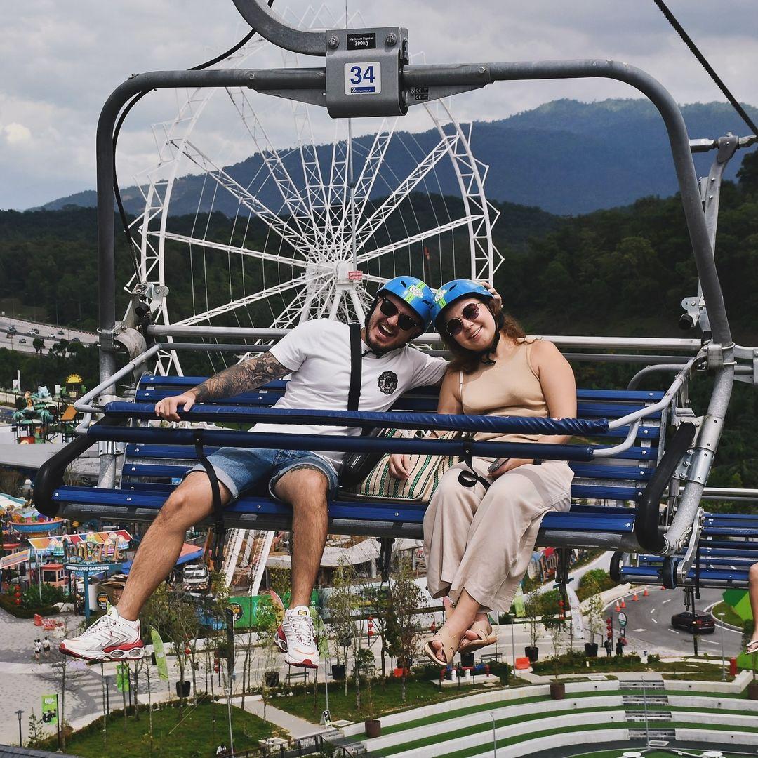 A couple poses for a photo on the Skyride at Skyline Luge Kuala Lumpur.