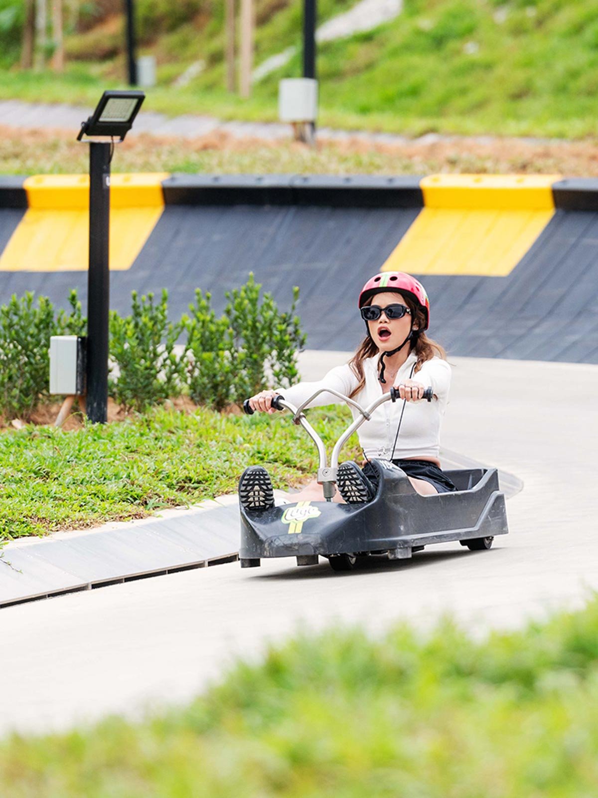 Skyline Luge Kuala Lumpur - Lady riding the Luge