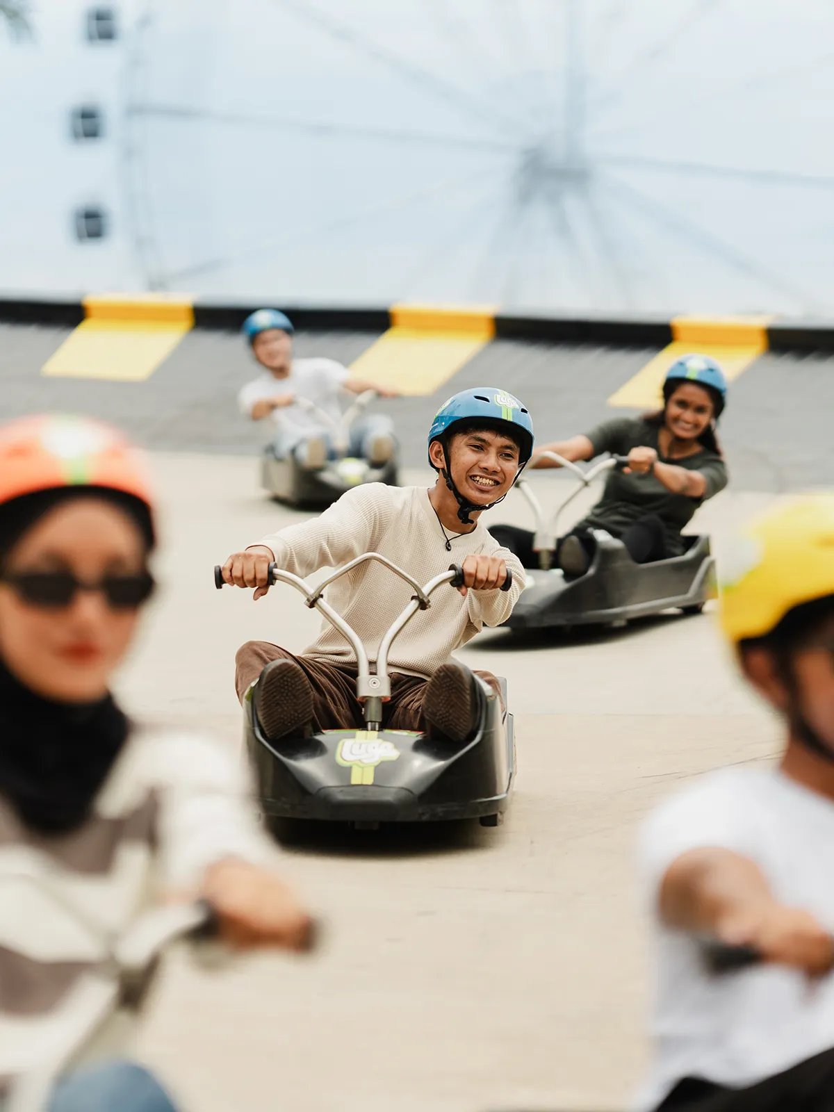 Skyline Luge Kuala Lumpur A Man riding the Luge Cart smiling