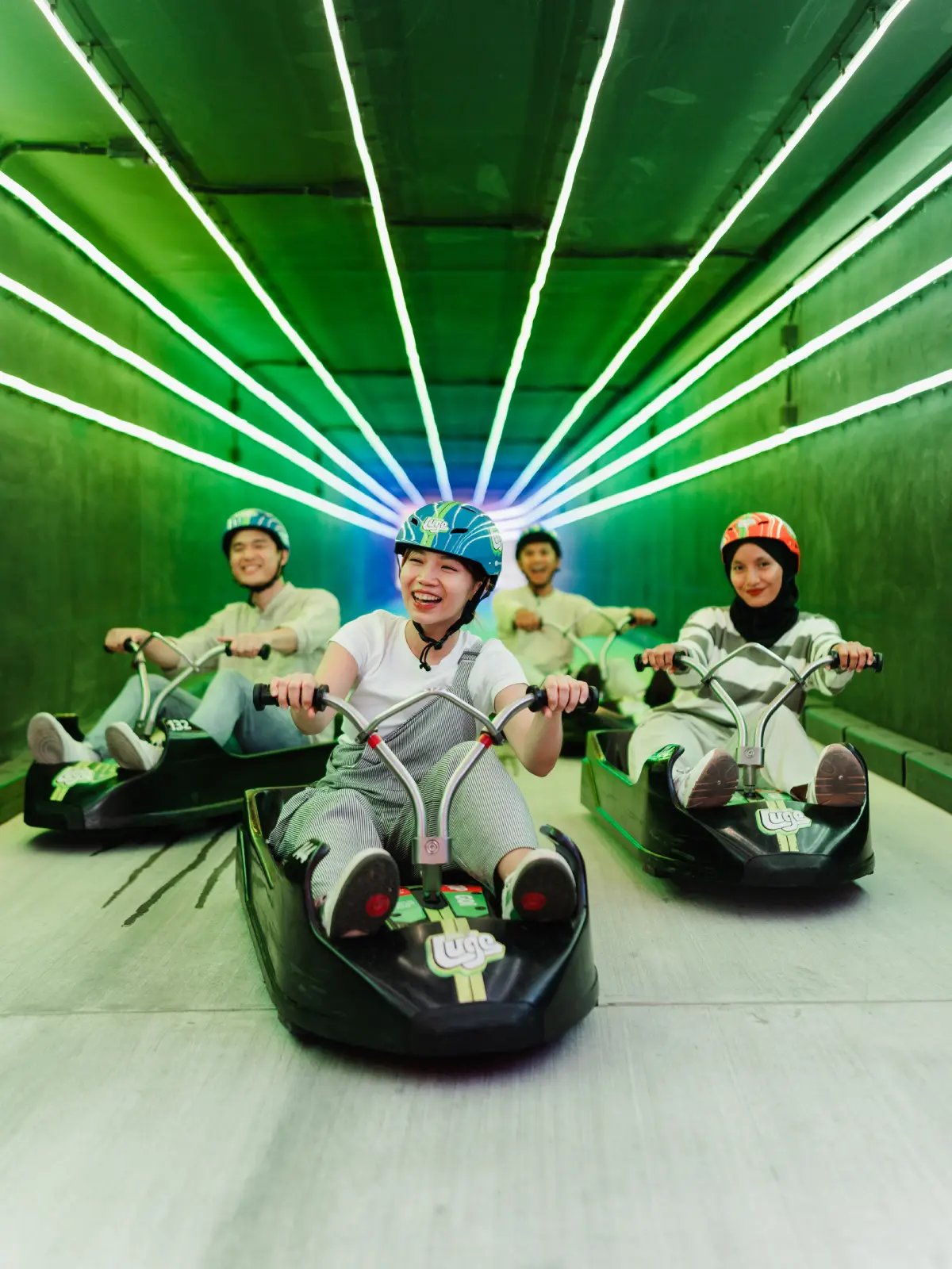 Skyline Luge Kuala Lumpur Friends riding the Luge Carts through the Tunnel section of the track