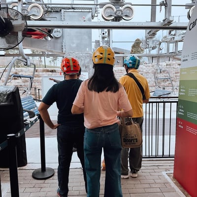 People waiting in line for the Skyride chairlift.
