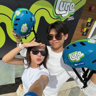 A couple takes a selfie at Skyline Luge Kuala Lumpur.