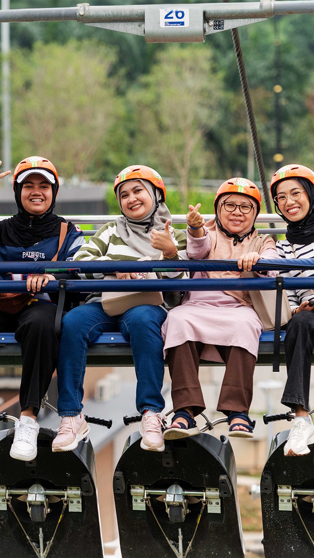 4 people smiling on the Skyride