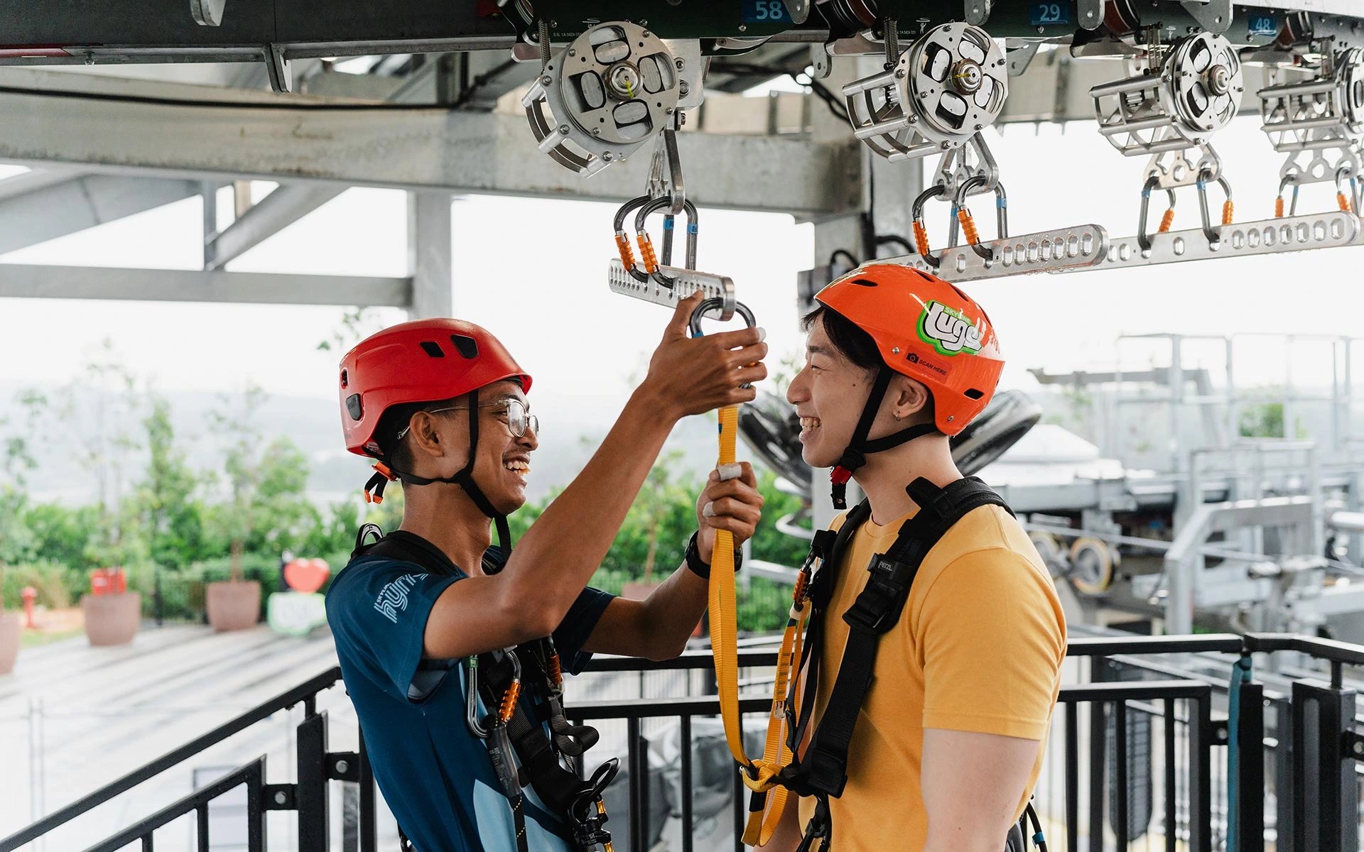 Skyline Luge Kuala Lumpur_Hyfly Zipline Staff helping Guest with Harness - 2