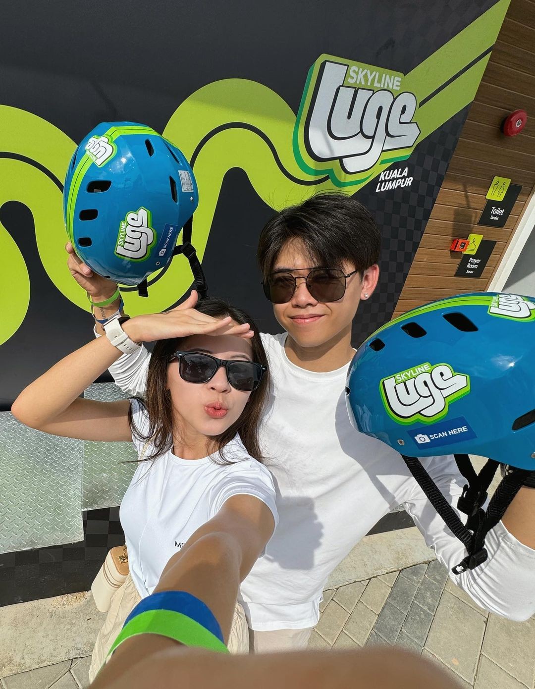 A couple takes a selfie at Skyline Luge Kuala Lumpur.