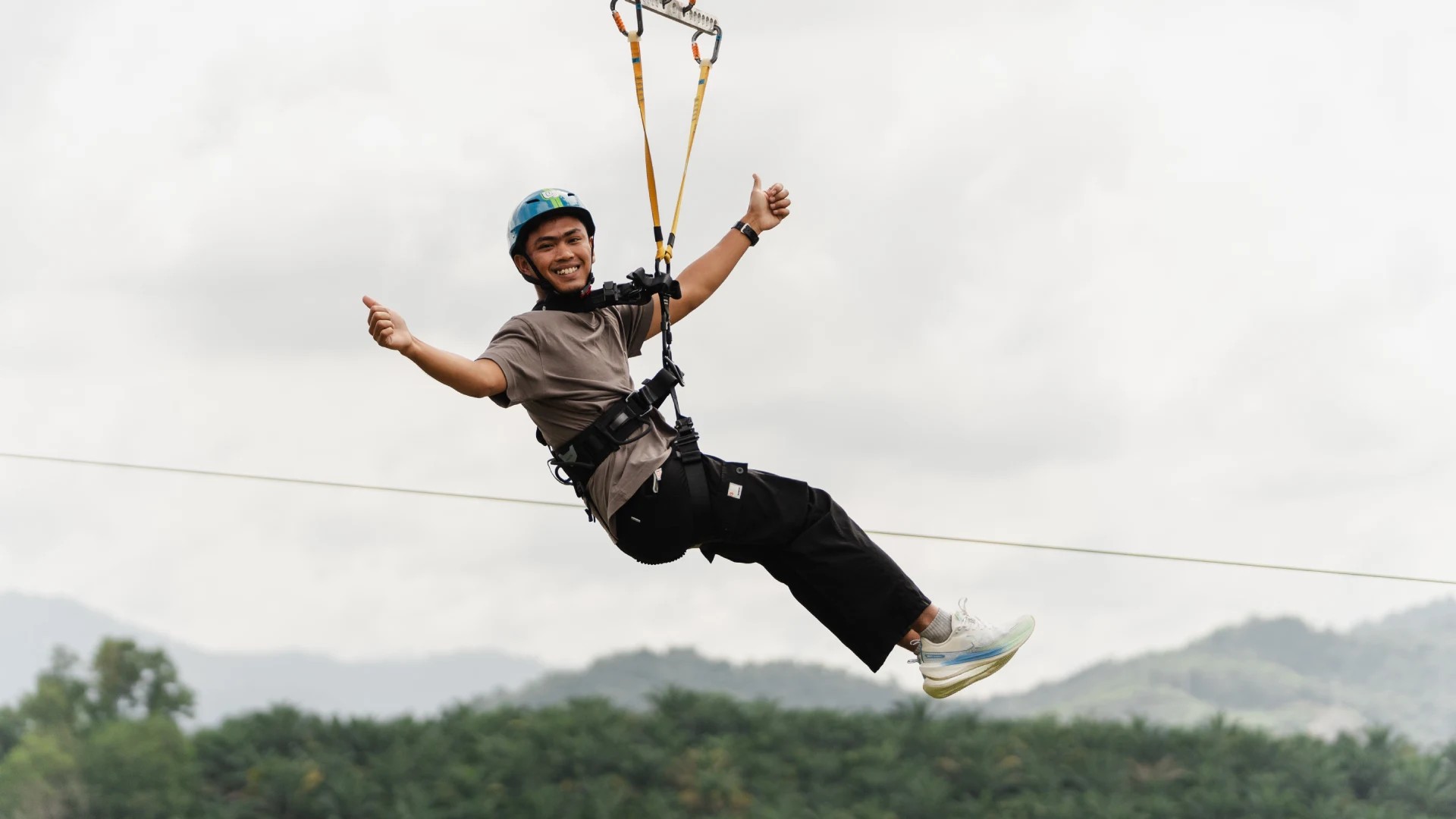 Skyline Luge Kuala Lumpur Man on the Hyfly Zipline giving thumbs up
