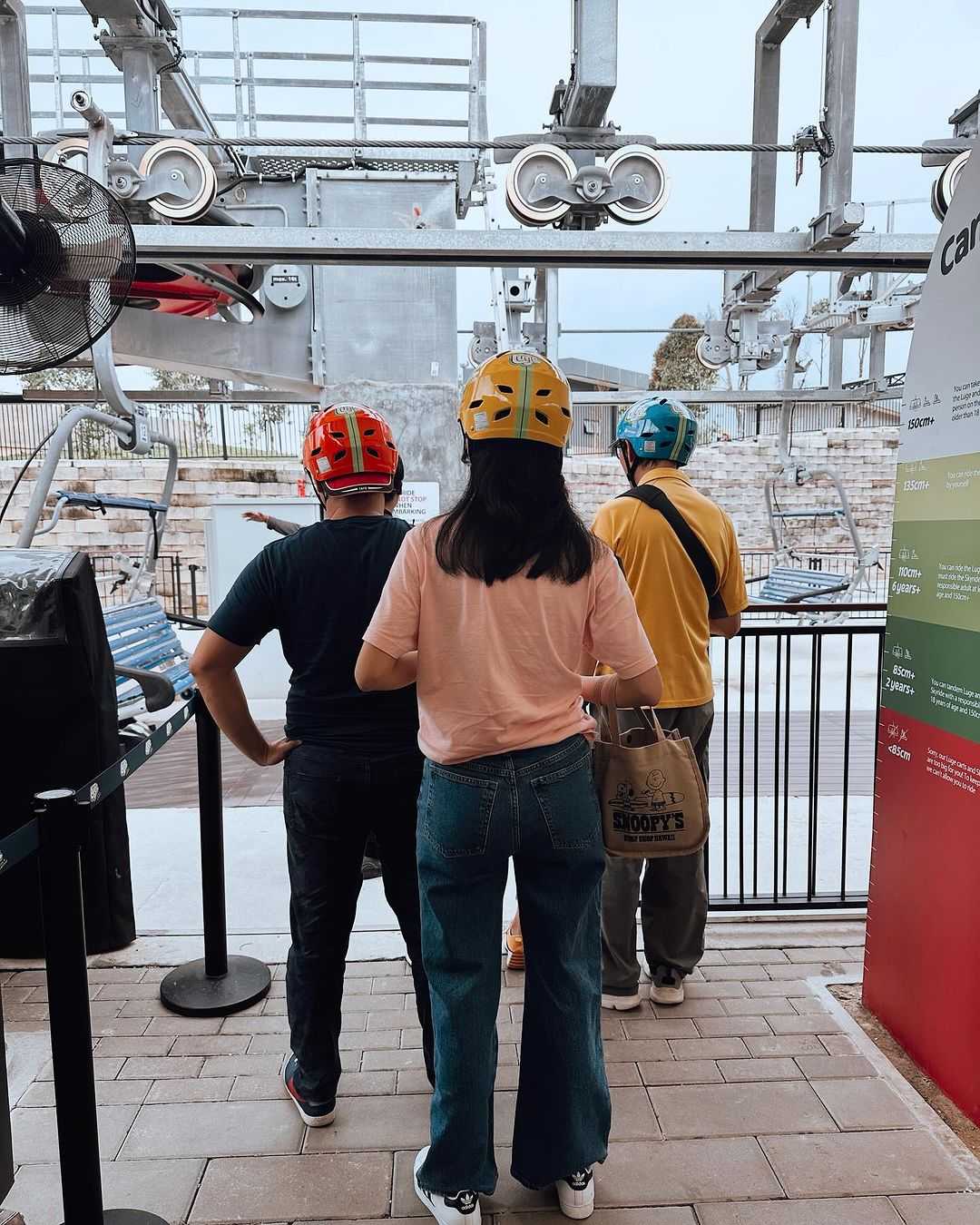 People waiting in line for the Skyride chairlift.