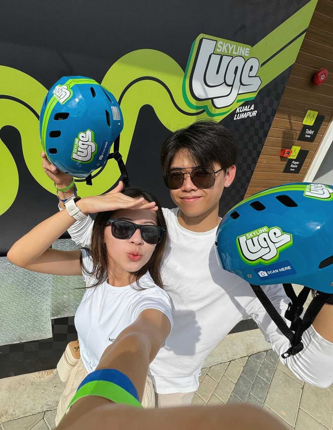 A couple takes a selfie at Skyline Luge Kuala Lumpur.